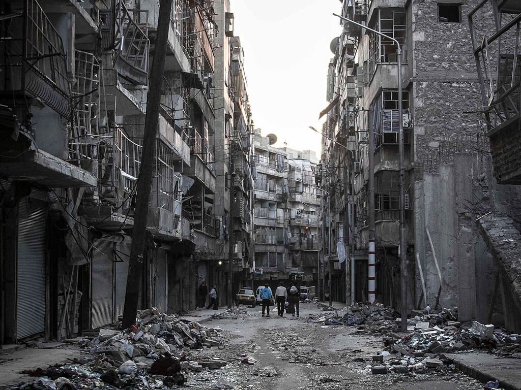 A ruined street after heavy shelling in Aleppo