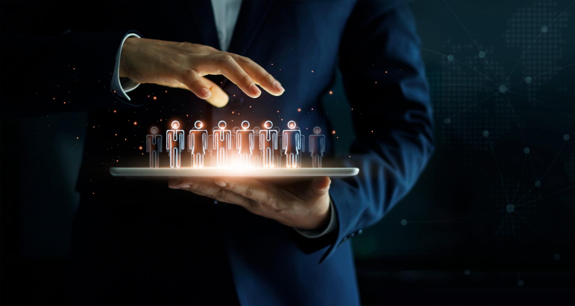 Businessman holding tablet and management group of people in his hand. Virtual icon of social network. Business technology concept.