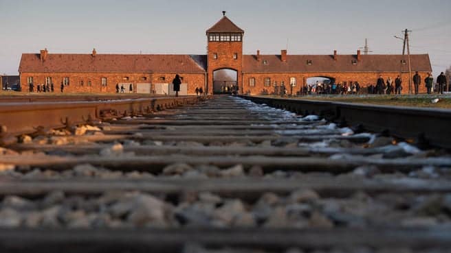 The entrance of Auschwitz-Birkenau. (Image- Getty)